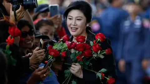 EPA Former Thai prime minister Yingluck Shinawatra is greeted by supporters as she arrives to deliver closing statements in her trial