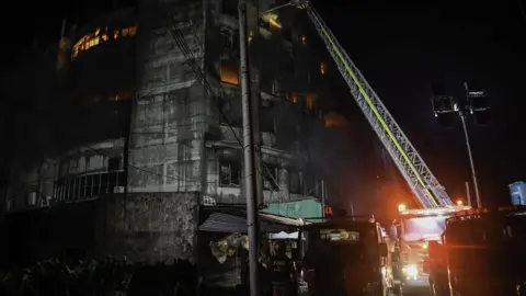 Getty Images Firefighters tackle blaze at Rupganj factory