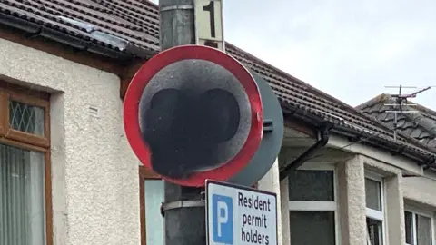 Defaced 20mph sign on Broad Street in Canton, Cardiff