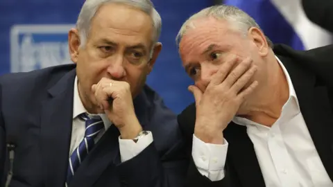 EPA Israeli Prime Minister Benjamin Netanyahu (L) and lawmaker David Amsalem (R) attend a meeting of the Likud party at the Knesset, in Jerusalem, Israel (25 December 2017)