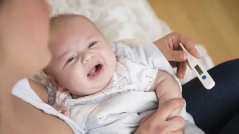 Getty Images Baby with a temperature