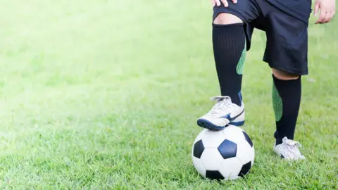 Getty Images Man with football