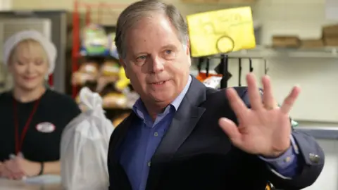 Reuters Democratic Alabama U.S. Senate candidate Doug Jones greets the media