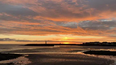 A red-sky sunset over Donaghadee Pier