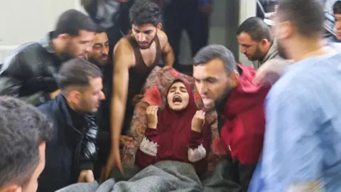 Reuters Injured Palestinian woman arrives at hospital