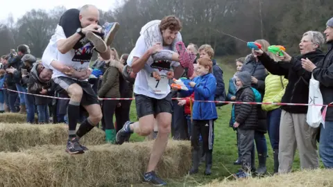 PA Competitors take part in the annual UK Wife Carrying Race