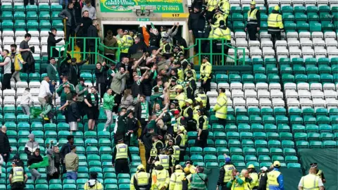 PA Media Celtic supporters at the end of the match
