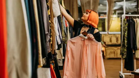 Yuup.co Meg Cox picking out clothes