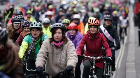 PA Media Protesters cycle through London