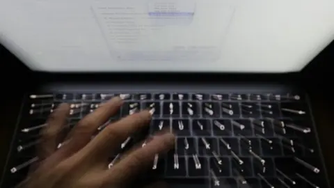 PA Hand on computer