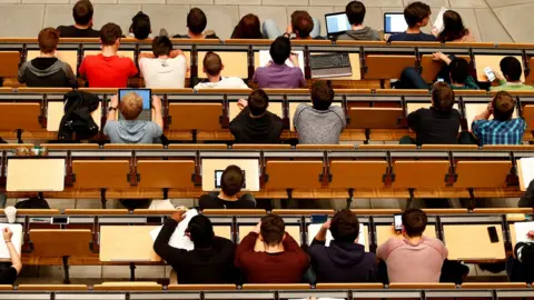 Reuters Students attending a lecture in an auditorium of a university