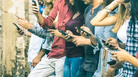 Getty Images people on phones