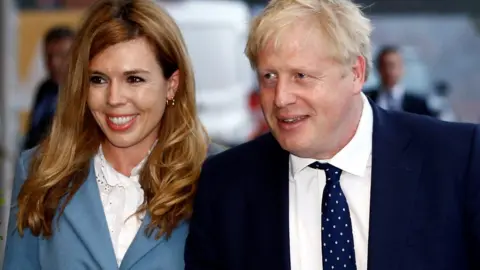 Reuters Boris Johnson and his girlfriend Carrie Symonds arrive at a hotel ahead of the Conservative Party annual conference in Manchester, on 28 September 2019