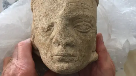 BBC stone head of monk
