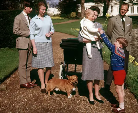 PA Queen Elizabeth and Prince Philip with their children