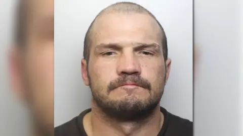Police name wanted Leeds axeman as David Riley