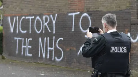 Michael Cooper/ PA Victory to the NHS graffiti in Londonderry