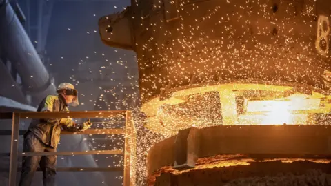 Getty Images A work mining and processing iron ore