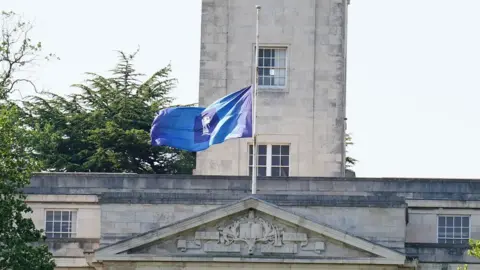 Mike Egerton/PA Wire Half mast flag