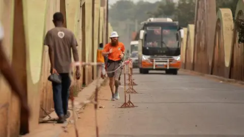 Guus van Veen Russell Cook running in Africa