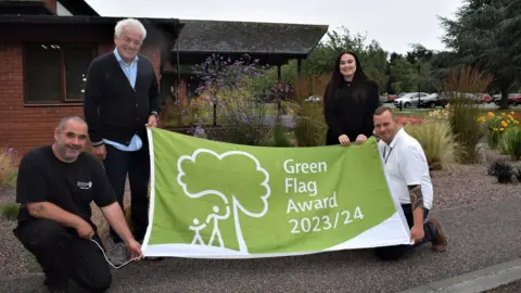 Mick Barry and council staff at Weeley Crematorium