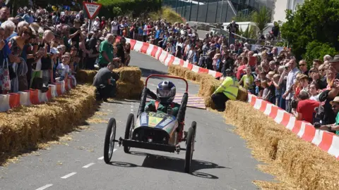 Johnny Morris Push-cart going down the street