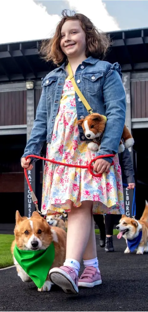 PA Media Paddy and his owner Claudia, who are both nine, took part in the race