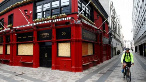 Reuters Belfast pub boarded up in May 2020