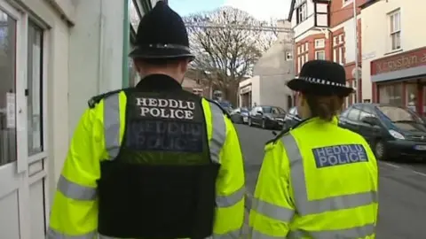 BBC Police officers on a street in Wales