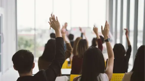 Getty Images pupils ask questions in a class room