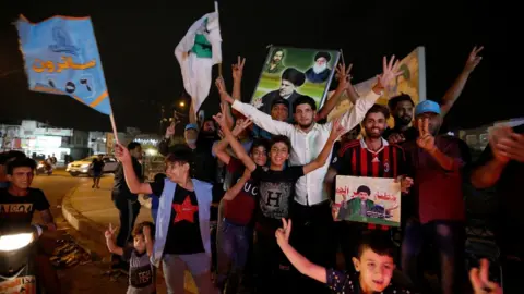 Reuters Supporters of Moqtada Sadr celebrate in Baghdad, Iraq (14 May 2018)
