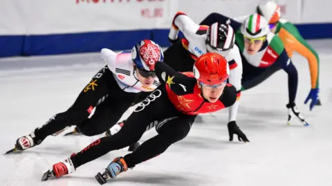 Getty Images Ice skaters racing