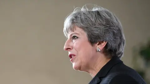 PA Profile view of Theresa May during speech