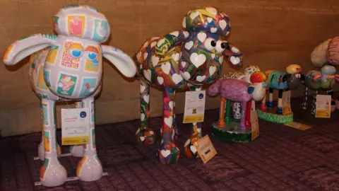 St Oswald's Hospice A line up of Shaun the Sheep sculptures