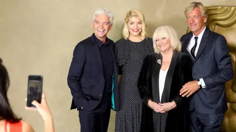 Getty Images Phillip Schofield, Holly Willoughby, Judy Finnigan and Richard Madeley attend a BAFTA tribute evening to long running TV show "This Morning" at BAFTA on October 1, 2018 in London, England