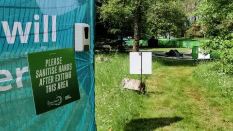 Great Run Company Sign asking people to sanitise their hands