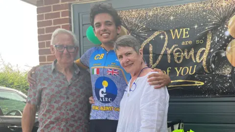 Connor Bennett/BBC Claudio Barchiesi with his grandparents Bernard and Pat Stoten