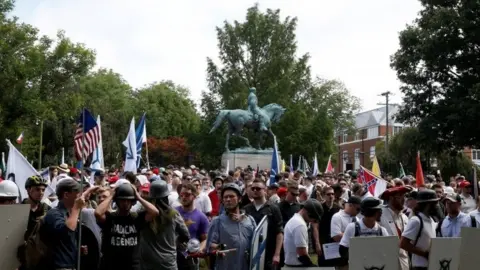 Reuters Far-right protesters converge around the statue of a Southern general