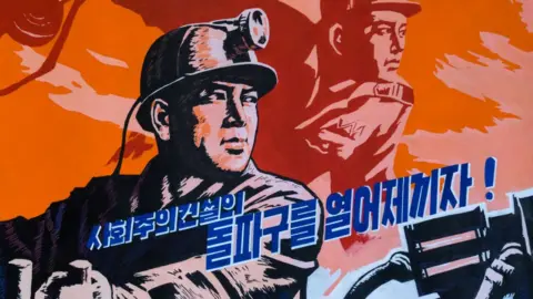 A North Korean propaganda poster depicting a miner, Pyongan Province, Pyongyang, North Korea on 6 December 2017 in Pyongyang