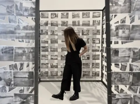 Dana Leslie & Iona Wheeler pictures hanging on metal and wooden structure