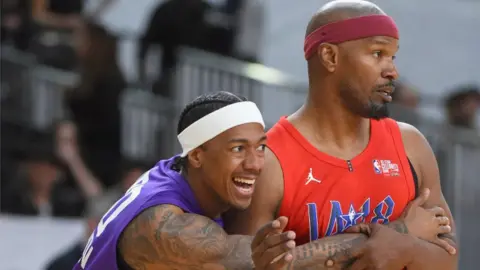 Getty Images Nick Cannon and Jamie Foxx