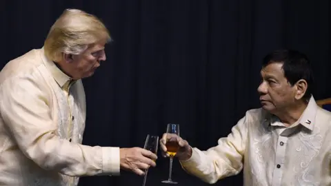 AFP Philippine President Rodrigo Duterte (R) toasts US President Donald Trump during a special gala celebration dinner for the Association of Southeast Asian Nations (ASEAN) in Manila on November 12, 2017.