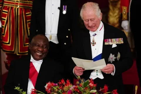 Reuters President Cyril Ramaphosa of South Africa, laughs as King Charles III speaks during the State Banquet held at Buckingham Palace, London, during the State Visit to the UK by the South African president
