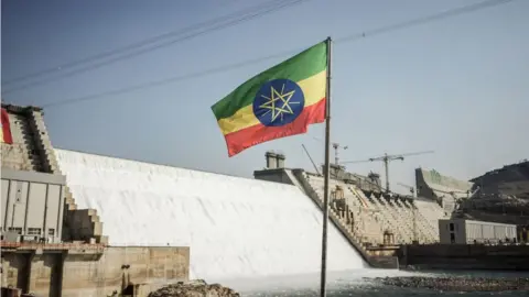 Ethiopian flag in front of the Grand Ethiopian Renaissance Dam (Gerd)