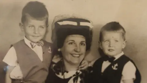 Family photo Shaun, his mum and sibling