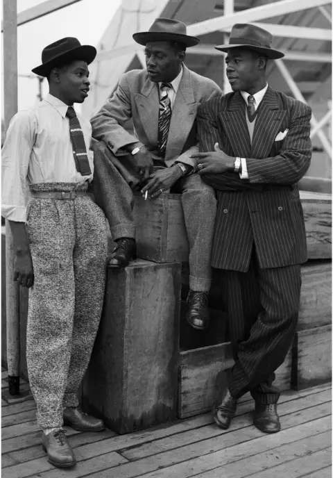 Getty Images Immigrants on board the 'Empire Windrush'