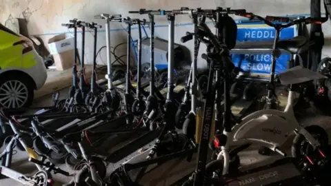 South Wales Police Some of the 23 e-scooters which have been seized in the last few weeks