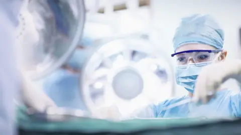 Getty Images Surgeon carrying out surgery