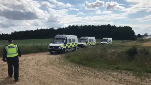 Norfolk Constabulary Police vans at rave site