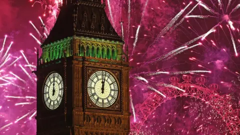 Getty Images Fireworks explode around Big Ben in London to mark New Year celebrations